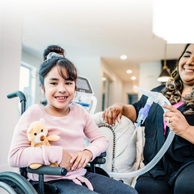 Volara system: old therapy for home care being utilized in the kitchen with older man in wheelchair