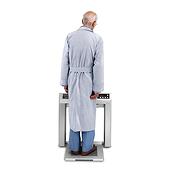 Patient standing on Stow-A-Weigh Stand-on Scale