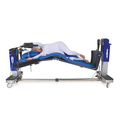 Vue latérale de la table avec patient en flexion latérale