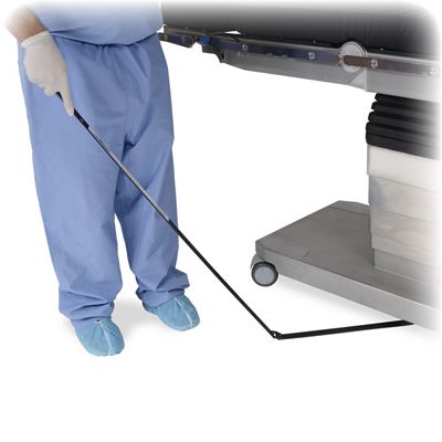 Needle Triever™ Device being swept under OR table by nurse