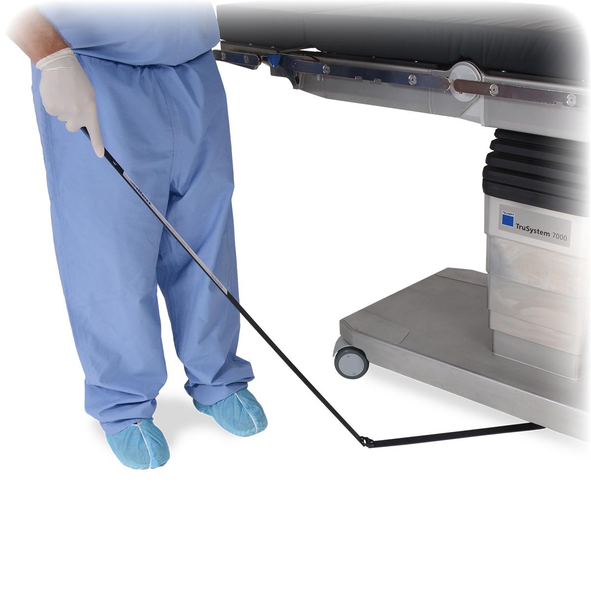 Needle Triever™ Device being swept under OR table by nurse