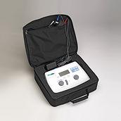 The Welch Allyn AM 282 portable audiometer in its black carry case, which features zippered pockets for cord storage.