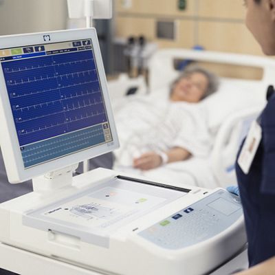 two doctors looking at a ecg results on a monitor