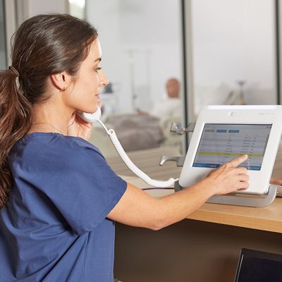 Nurse using Voalte Nurse Call at the nurse station