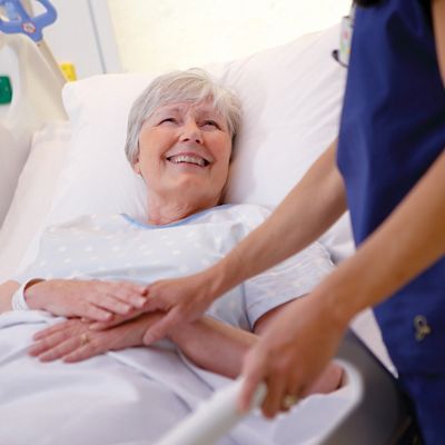 Patient laying on Hillrom Centrella Bed