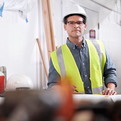 a construction solutions team member smiles