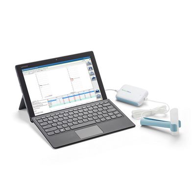 A computer displays data collected with the Welch Allyn Diagnostic Cardiology Suite software. A spirometer is attached.