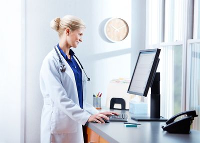 care worker checks computer