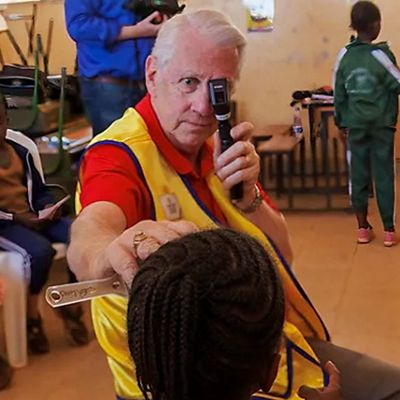 Dr. Cordes looking at a child for an eye exam