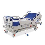 A Hillrom™ Envella therapy bed with an air-fluidized surface. The head position is slightly inclined and the siderails are up.