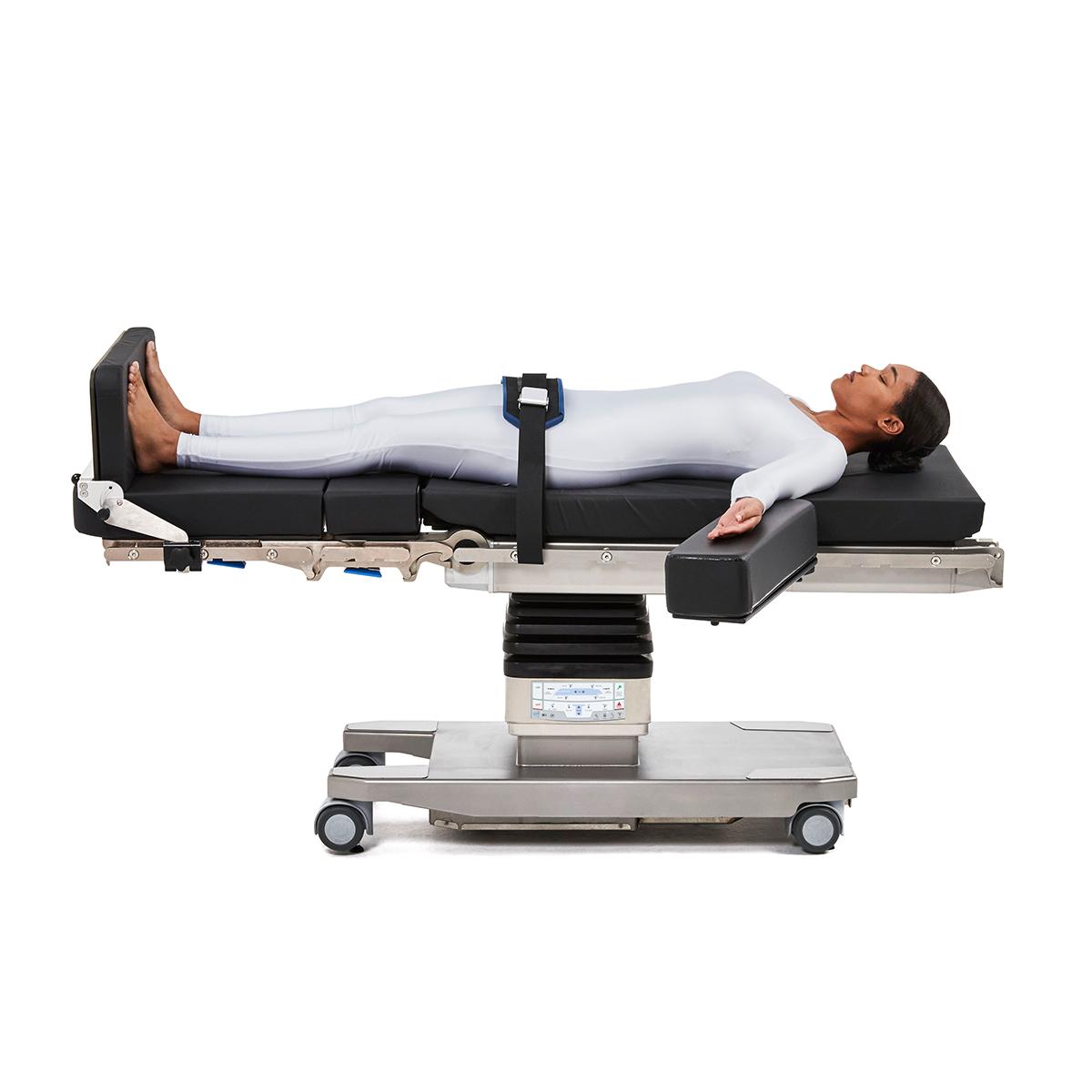 Patient positioned on Hillrom surgical table equipped with general accessories.