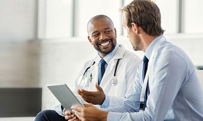 A distributor representative discussing products with a medical professional