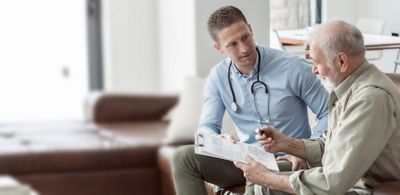 Doctor meeting with patient - Hillrom Financial Services