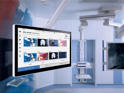 A video screen is shown in the OR.