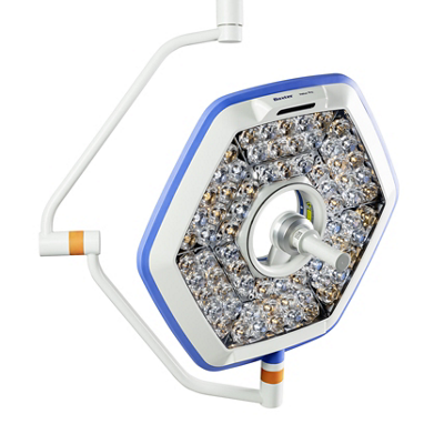 Clinician grasps sterile handle to adjust Helux Pro surgical light 
