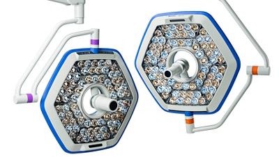 A clinician operates a Progressa bed system with patient seated within