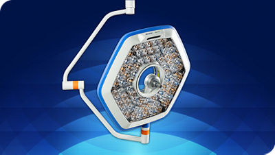 Clinician grasps sterile handle to adjust Helux Pro surgical light 