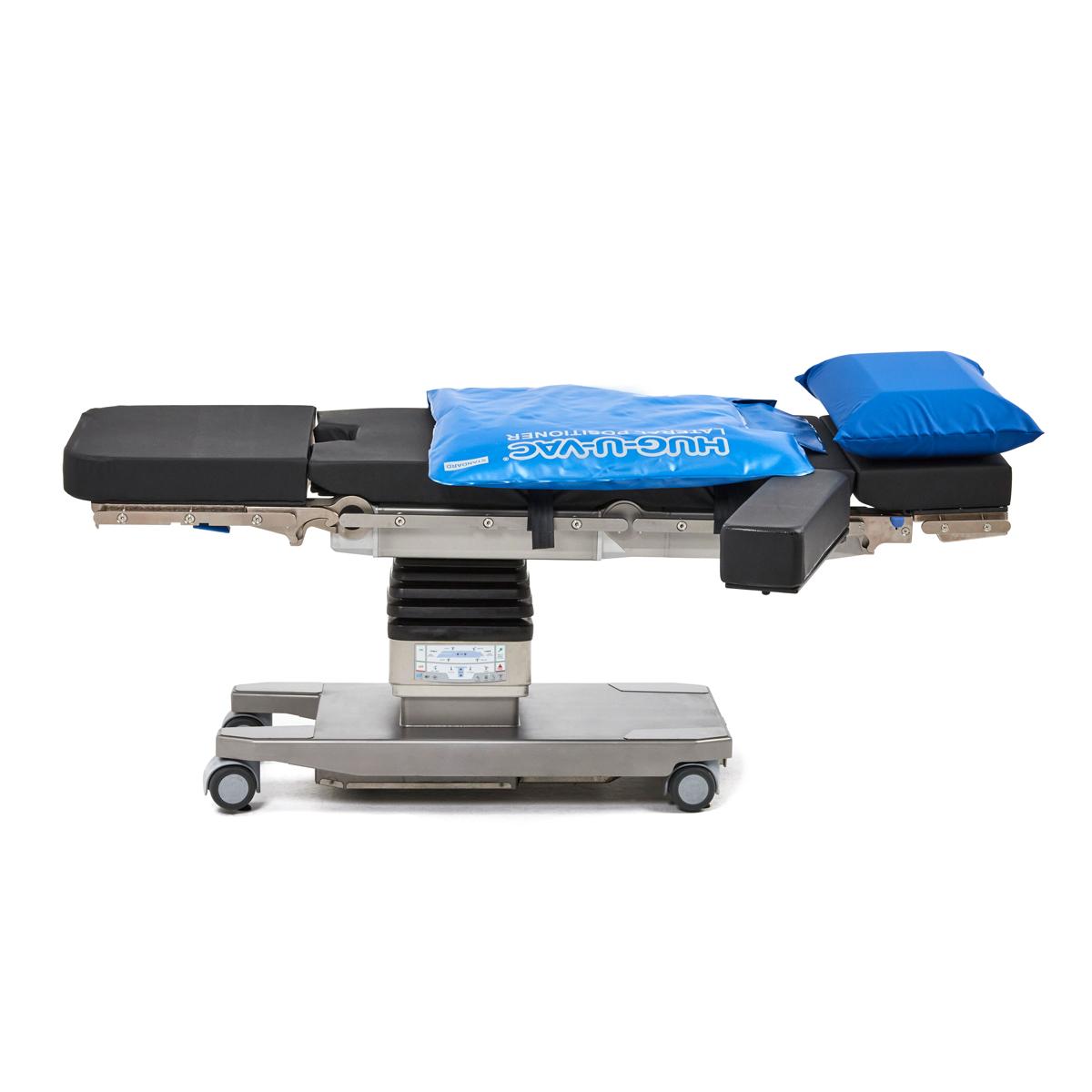 Hillrom surgical table equipped with Lateral Hug-U-Vac accessories.