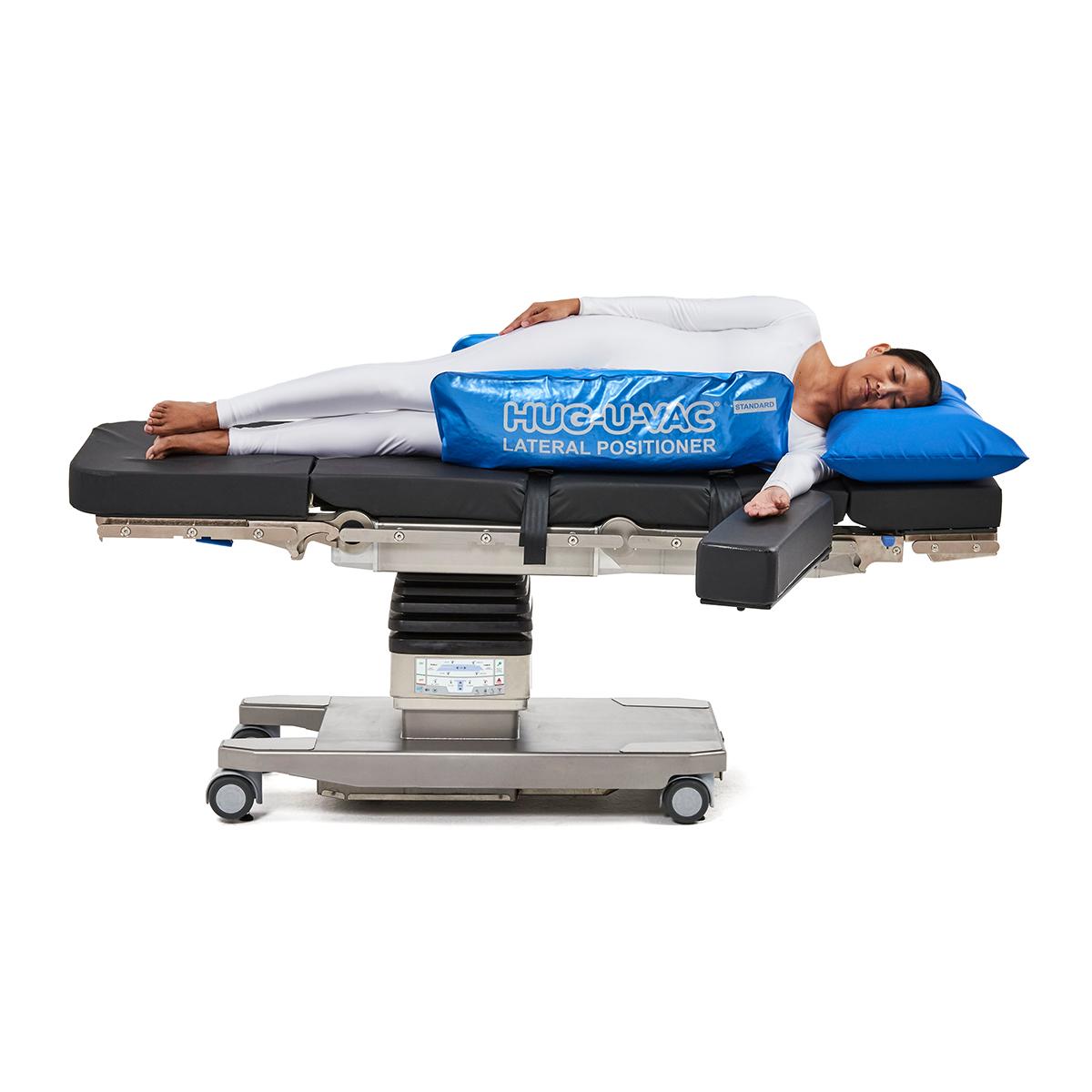 Hillrom surgical table equipped with Lateral Hug-U-Vac accessories.