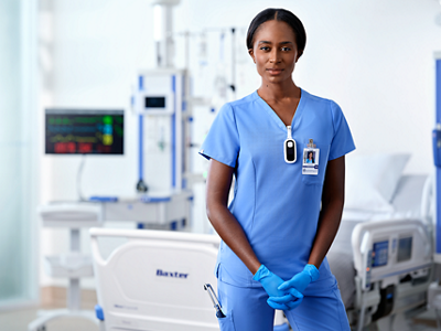 Nurse stands in the hall of the ICU
