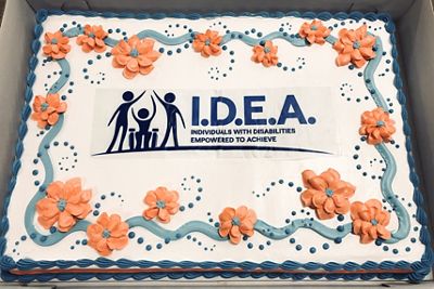A cake features the I.D.E.A. employee resource group logo