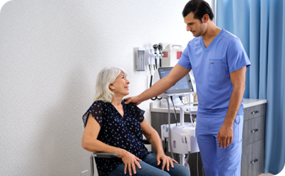 nurse touching patient with welch allyn connex 360 behind him