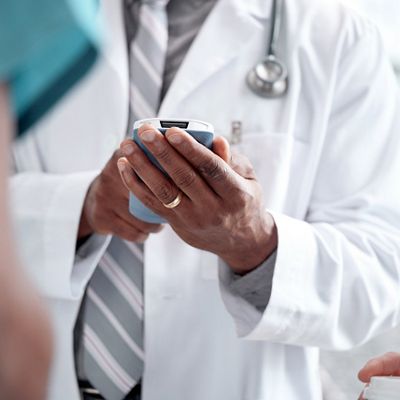 team of hospital staff meeting at a desk in a conference room