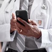 Physician holding smartphone
