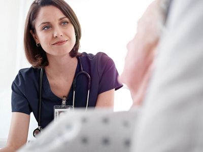 nurse responding to Voalte mobile app alert from patient in Centrella Smart+ bed