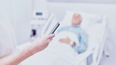 Team of surgeons operating in hybrid operating room 