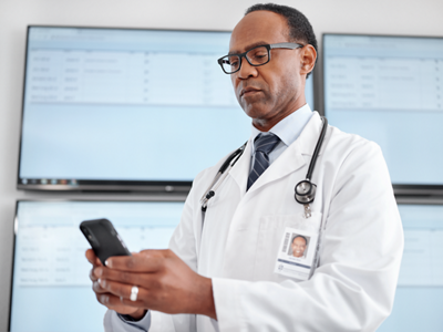 Nurse holding a patient's hand