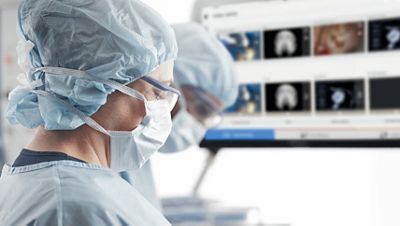 Nurses in front of screen