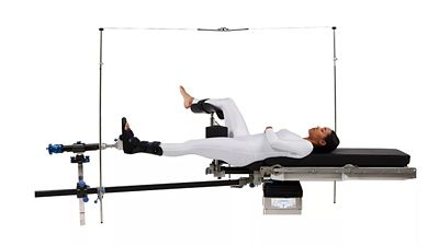 Patient positioned on a Hillrom surgical table using orthopedic extension accessories.