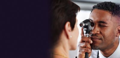 A physician uses a Welch Allyn PanOptic Plus Ophthalmoscope to examine his patient’s eyes