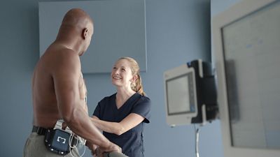 Clinician with patient using Q-Stress System