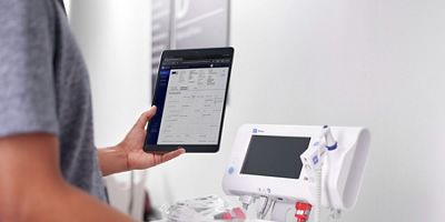 A biomedical engineer uses SmartCare Remote Management on their tablet to confirm a preemptive device accessory replacement.  