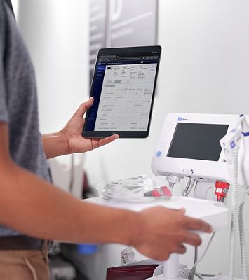 A biomedical engineer uses SmartCare Remote Management on their tablet to confirm a preemptive device accessory replacement.  