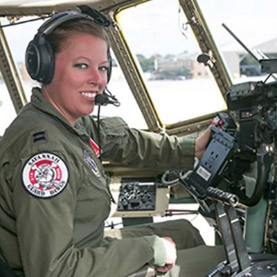 woman sitting in a cockpit in an airplane