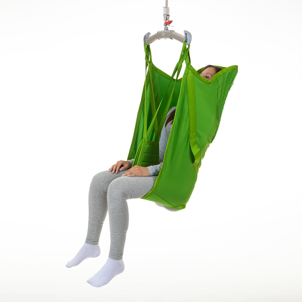 A patient sits in a soft Hillrom highback sling
