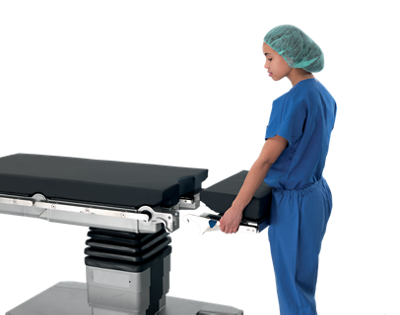 A clinician detaches a segment of the Surgical Table
