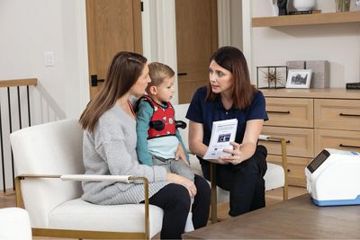 The Vest APX System in the living room with son and mother