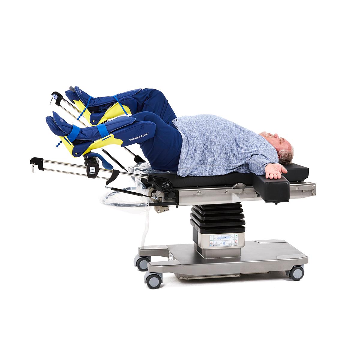 Bariatric patient positioned on Hilllrom surgical table equipped with Urology Deluxe accessories. 