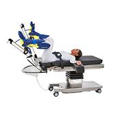Patient positioned on Hilllrom surgical table equipped with Urology Deluxe accessories.