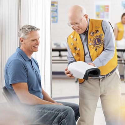 a man performs a vision screening
