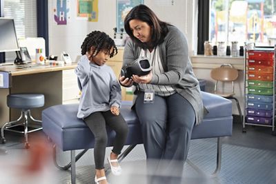 Female pediatric patient with nurse