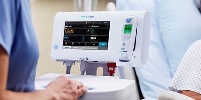 a caregiver using a Welch Allyn monitor