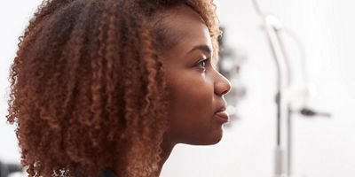 side view of woman looking forward  