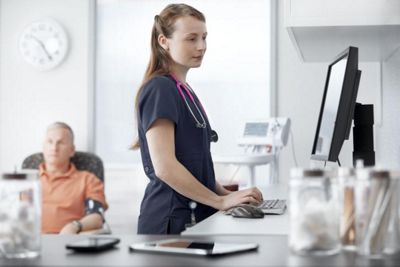 Close up of the Connex Integrated Wall System in use by a care giver