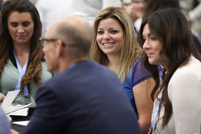 A group of Hillrom employees smile and talk during a Hillrom Professional Women’s Group networking event 