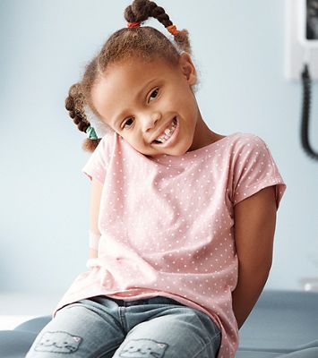A young girl in a physician's exam room